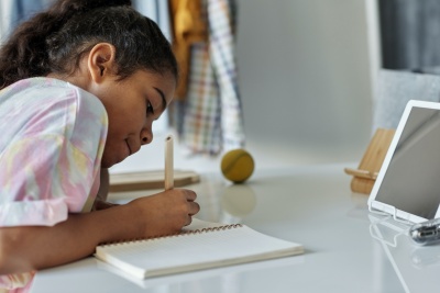 photo-of-girl-writing-on-white-paper